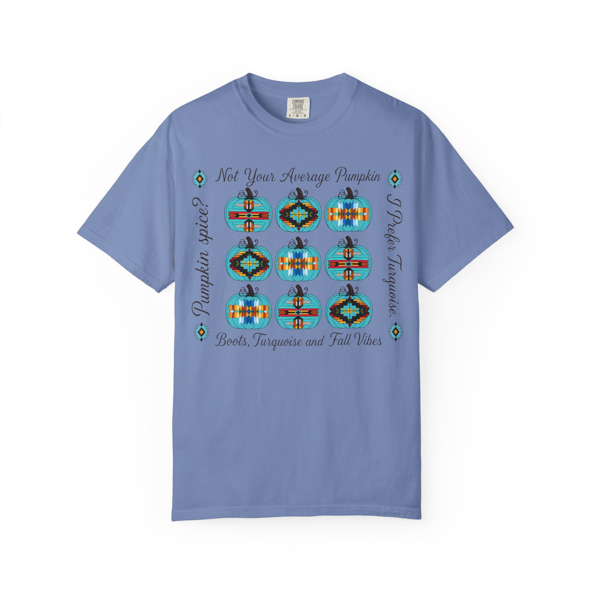 A light blue short-sleeve t-shirt with a graphic print featuring nine colorful geometric pumpkins arranged in a 3x3 grid, with text reading 'Not Your Average Pumpkin' and 'Pumpkin Spice Boots, Tarotique and Fall Vibes'.
