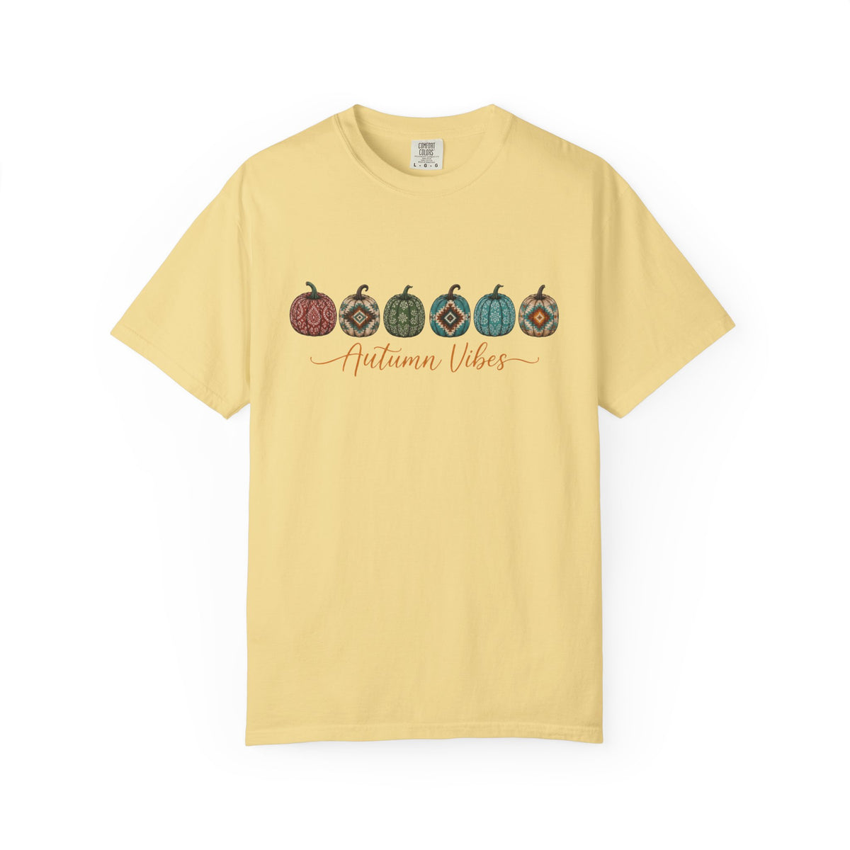 A pale yellow short-sleeve crewneck t-shirt featuring a graphic of six patterned pumpkins and the words 'Autumn Vibes' in orange script across the chest, displayed on a clean white background.