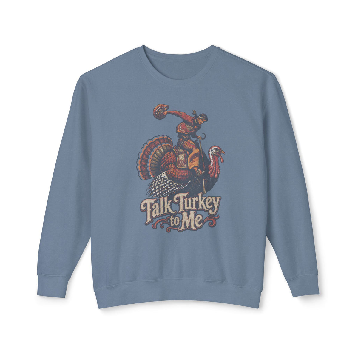 A dusty blue crewneck sweatshirt featuring a vintage-style graphic of a woman riding a large turkey with the text 'Talk Turkey to Me' printed below it, displayed on a clean white background.
