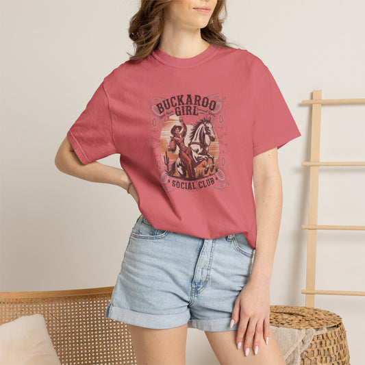 Buckaroo Spirits tee with vintage cowgirl riding horse graphic and western paisley border on model in color watermelon