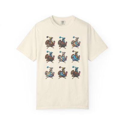 An off-white short-sleeve t-shirt featuring a 3x3 grid of nine pixel-art illustrations of a cowboy riding a rooster, displayed on a clean white background.