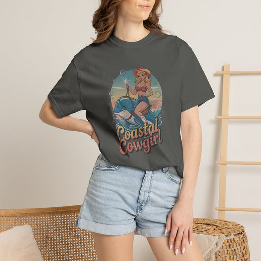 Person wearing a t-shirt with 'Coastal Cowgirl' design in a casual setting