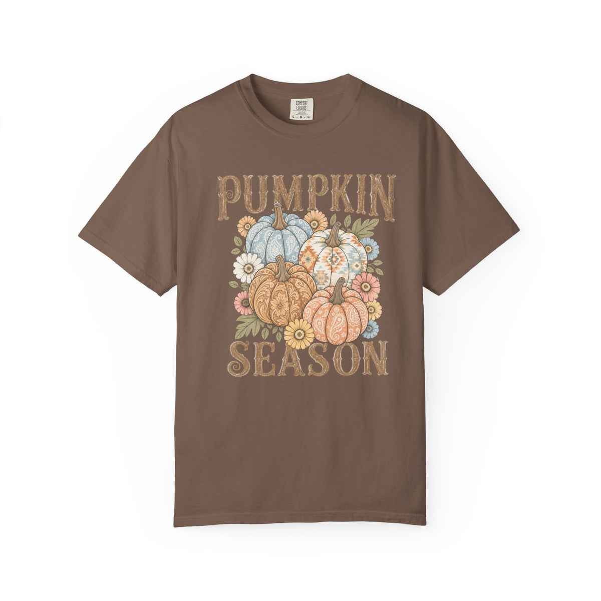 A brown short-sleeve crewneck t-shirt featuring a 'Pumpkin Season' graphic on the front with illustrated pumpkins, flowers, and a distressed font, displayed on a clean white background.
