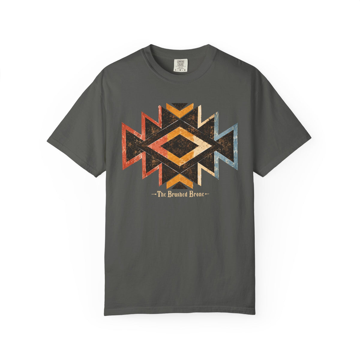 A dark gray crewneck t-shirt featuring a distressed geometric Southwestern-style diamond graphic in orange, yellow, and blue, with the text '- The Brushed Bronc-' printed below it.