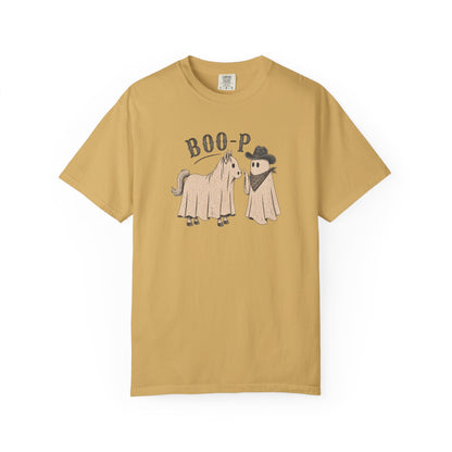 A mustard yellow short-sleeve t-shirt with a graphic of a horse and a cowboy ghost under the text 'BOO-P', displayed on a clean white background.