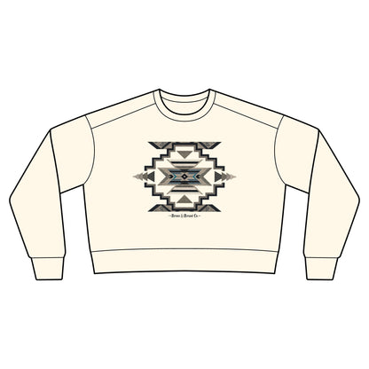 An off-white crewneck sweatshirt with a central geometric Southwestern-style graphic in black, gray, and blue, featuring the text 'Bro nc & Brand Co.' below the design.