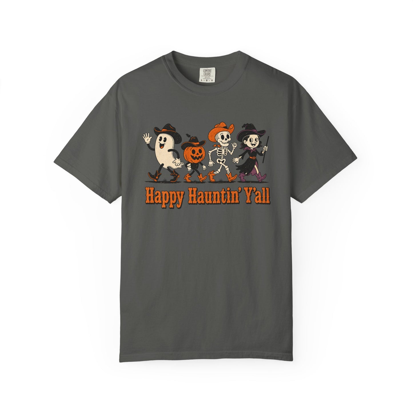 A pepper crewneck t-shirt featuring a cartoon graphic of a ghost, a pumpkin, and a skeleton dancing, with the text 'Happy Haunting' Y'all' printed below in orange.