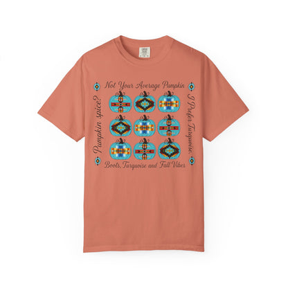 A terracotta orange short-sleeve t-shirt with a graphic print featuring nine decorated pumpkins, the text 'Not Your Average Pumpkin', 'Pumpkin Spice?', and 'Boot, Taquerie and Fall Vibes' on a plain white background.