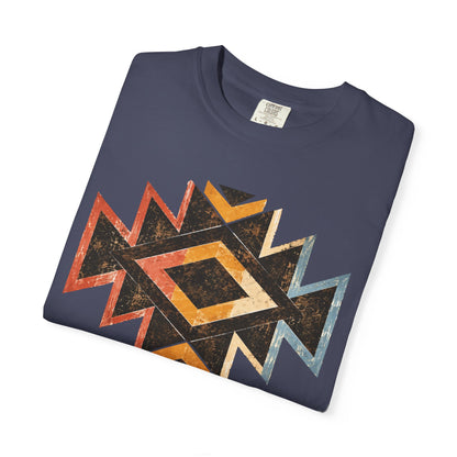 A navy blue folded t-shirt with a distressed geometric Southwestern-style diamond pattern in orange, yellow, black, and light blue, displayed on a clean white background.