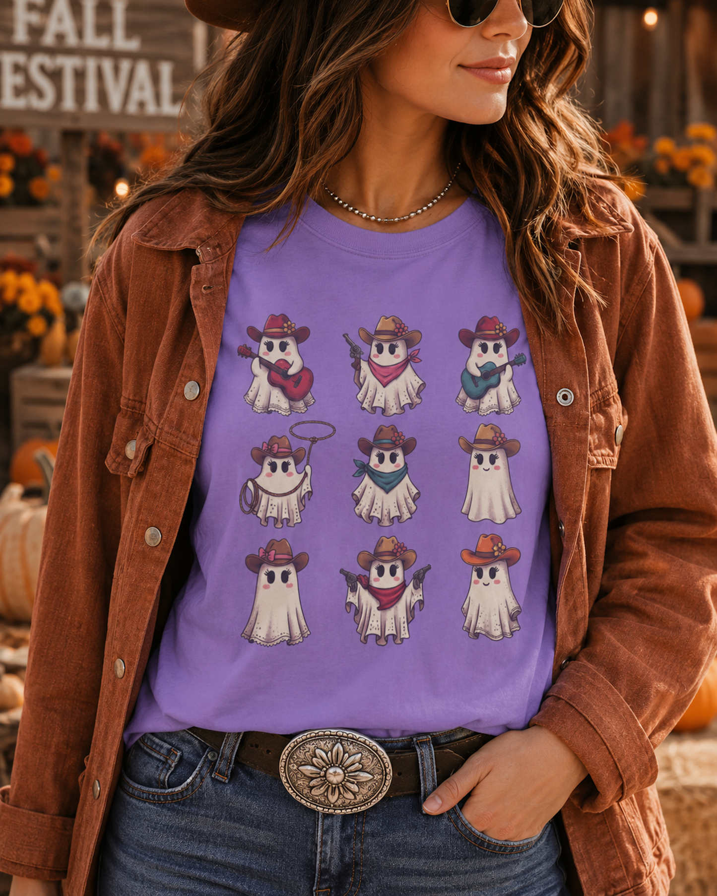 CowGhouls western Halloween tee with nine cute cowgirl ghosts in cowboy hats on a violet tee