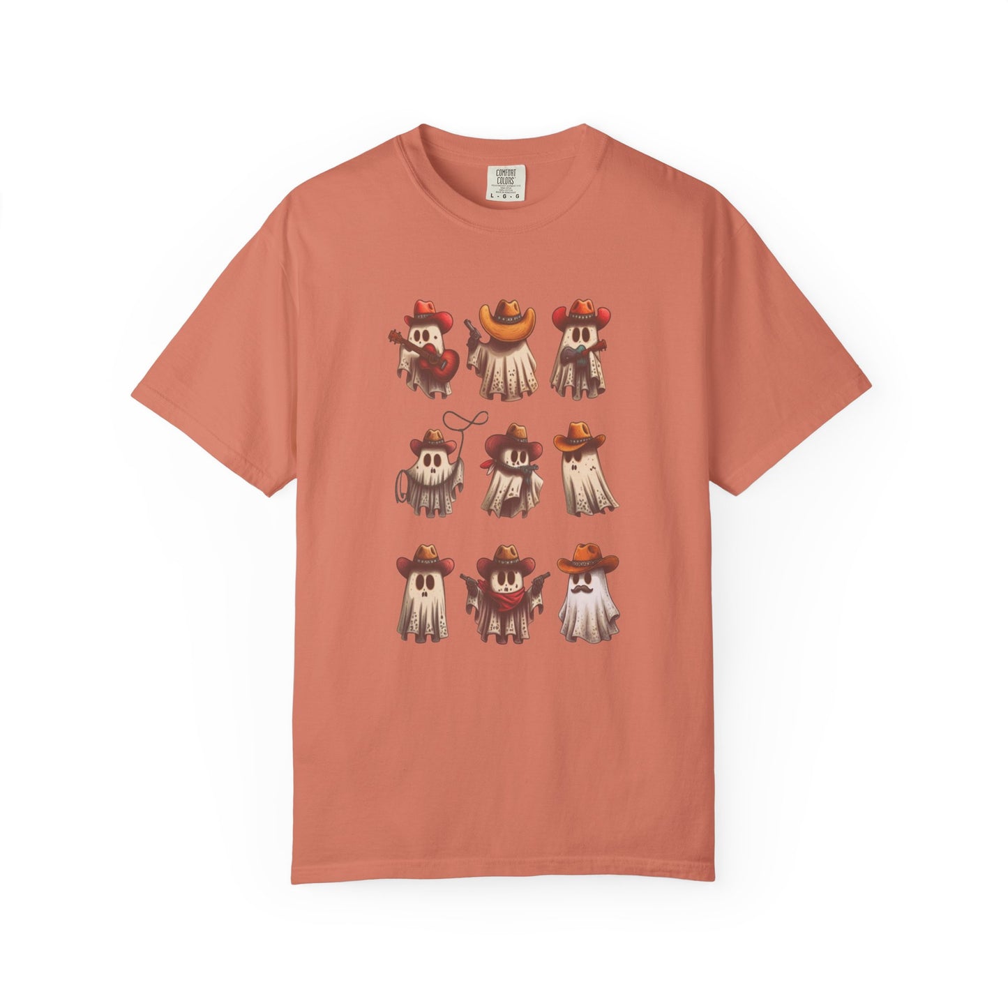 A peach-colored short-sleeve t-shirt with a graphic print of nine cute cartoon ghosts wearing various cowboy hats, displayed on a clean white background.