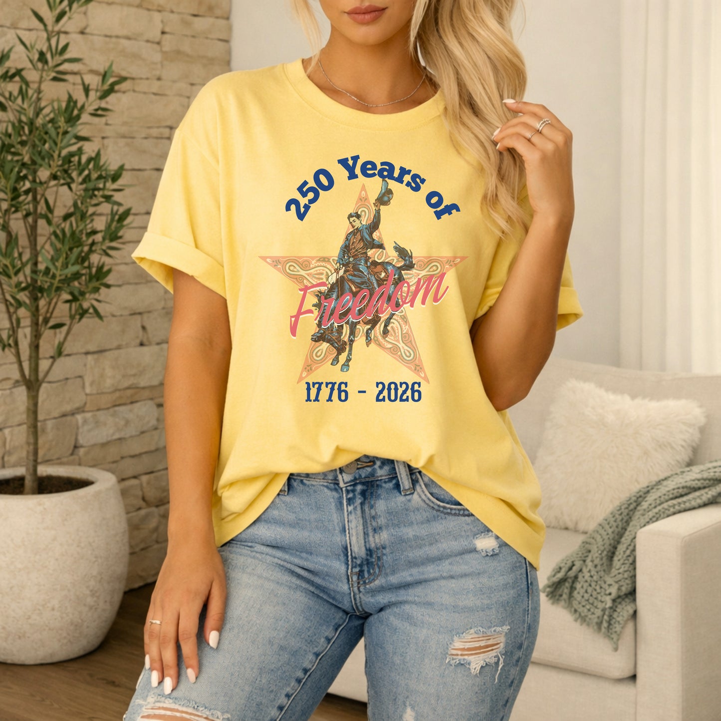 250 Years of Freedom tee with 1776 to 2026 patriotic graphic on model in butter