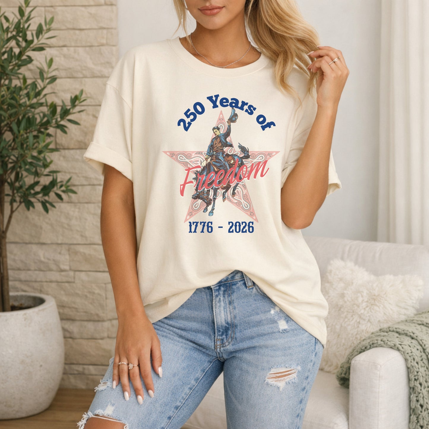 250 Years of Freedom tee with 1776 to 2026 patriotic graphic on model in ivory