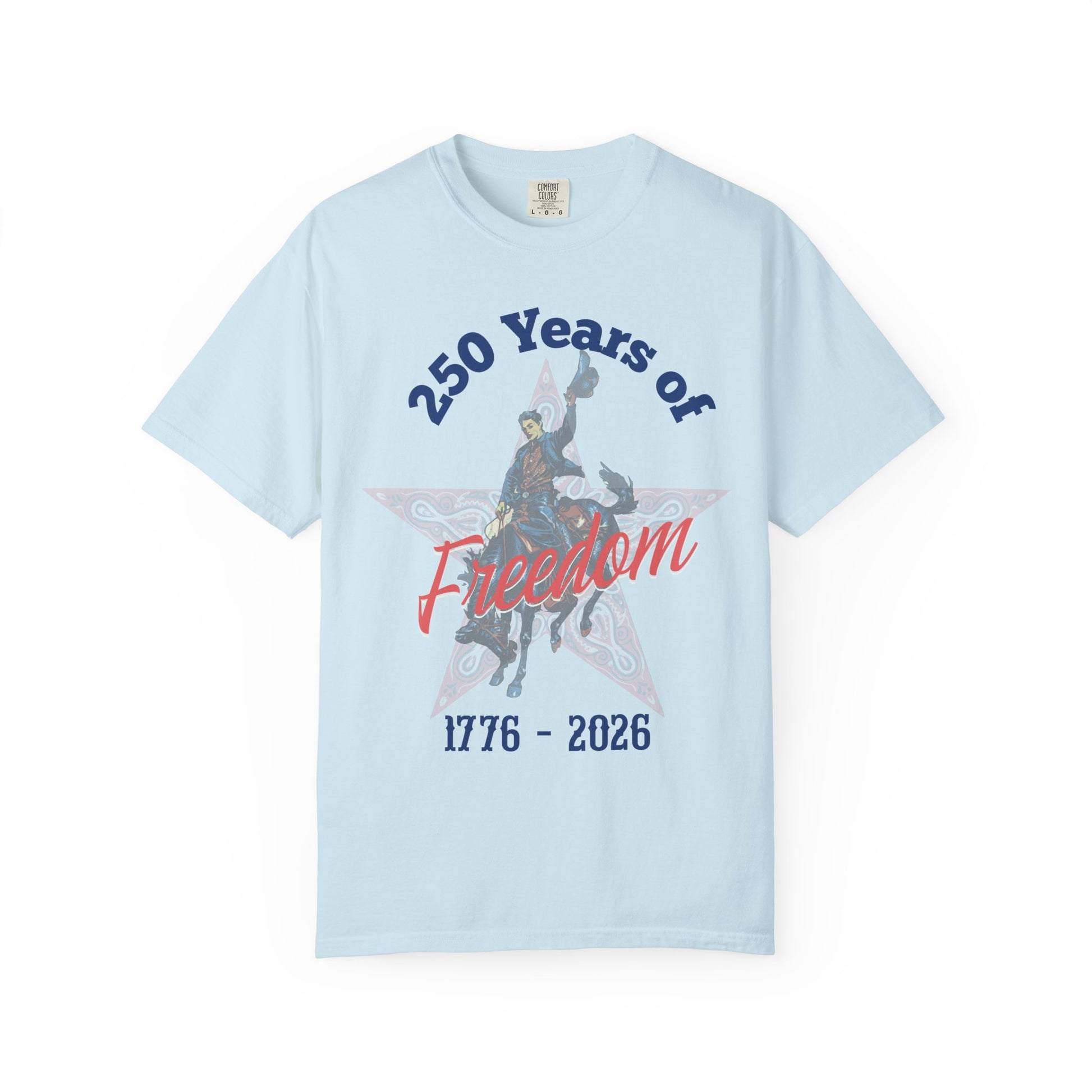 250 Years of Freedom tee with 1776 to 2026 patriotic graphic tee laying flat on white background in color chambray