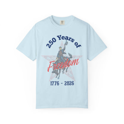 250 Years of Freedom tee with 1776 to 2026 patriotic graphic tee laying flat on white background in color chambray