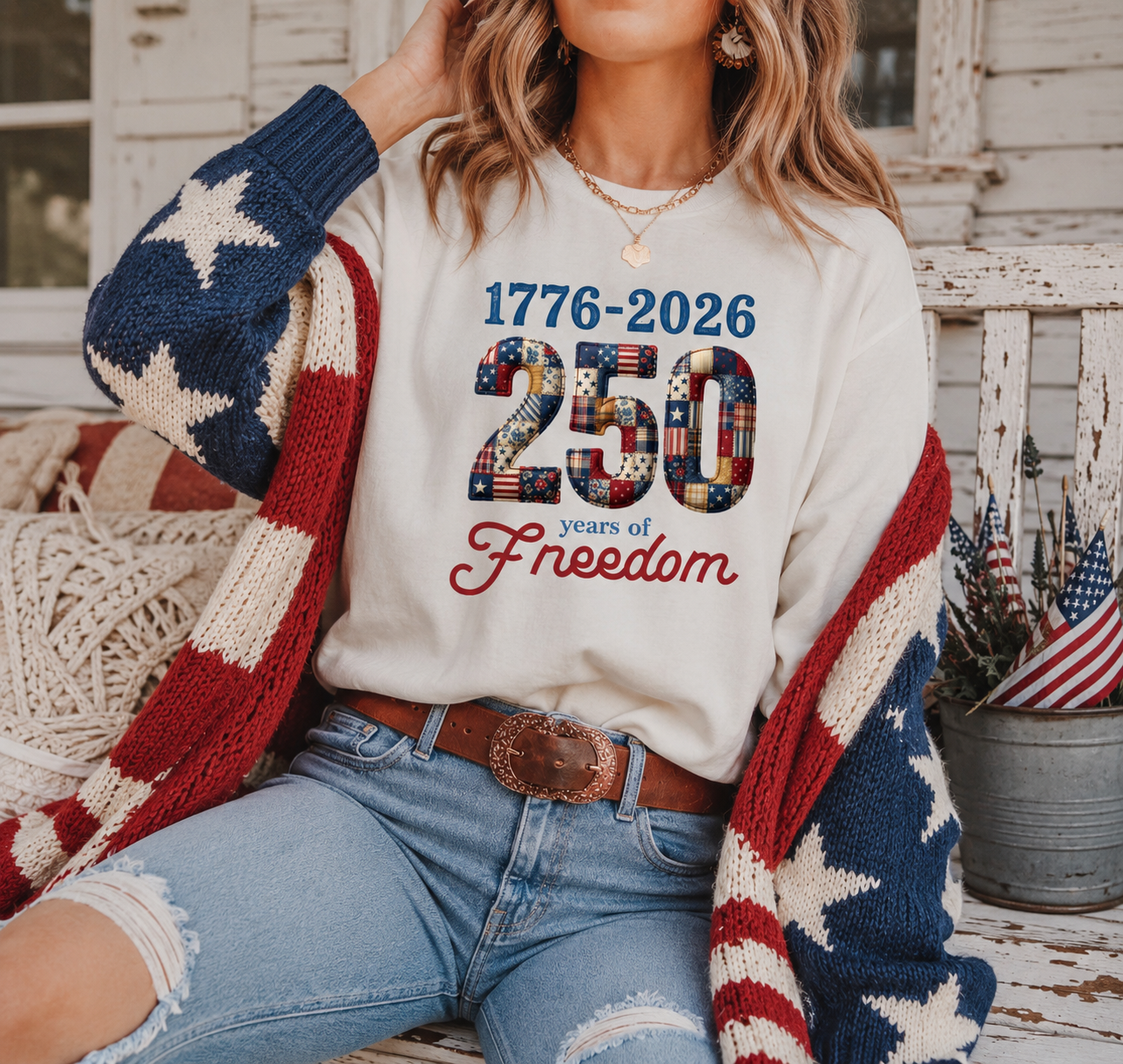 250 Years of Freedom tee with vintage patchwork Americana 1776 to 2026 graphic on female model sitting on porch