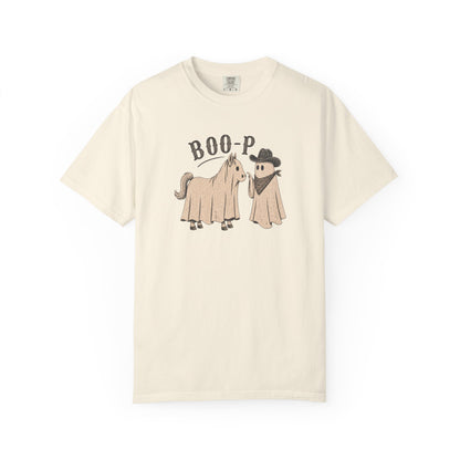 Beige t-shirt with a ghost horse and ghost cowboy graphic and text on a white background