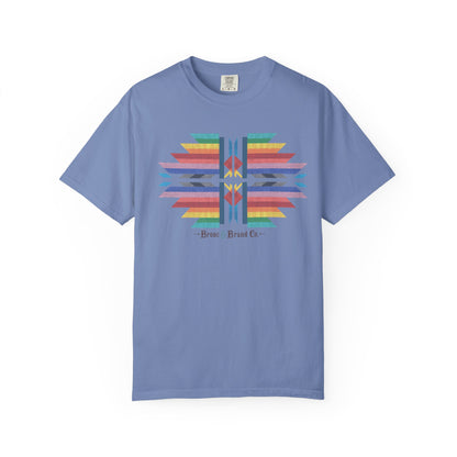 A light blue crewneck t-shirt featuring a colorful geometric graphic on the chest with the text '-Bronc & Brand Co-'.