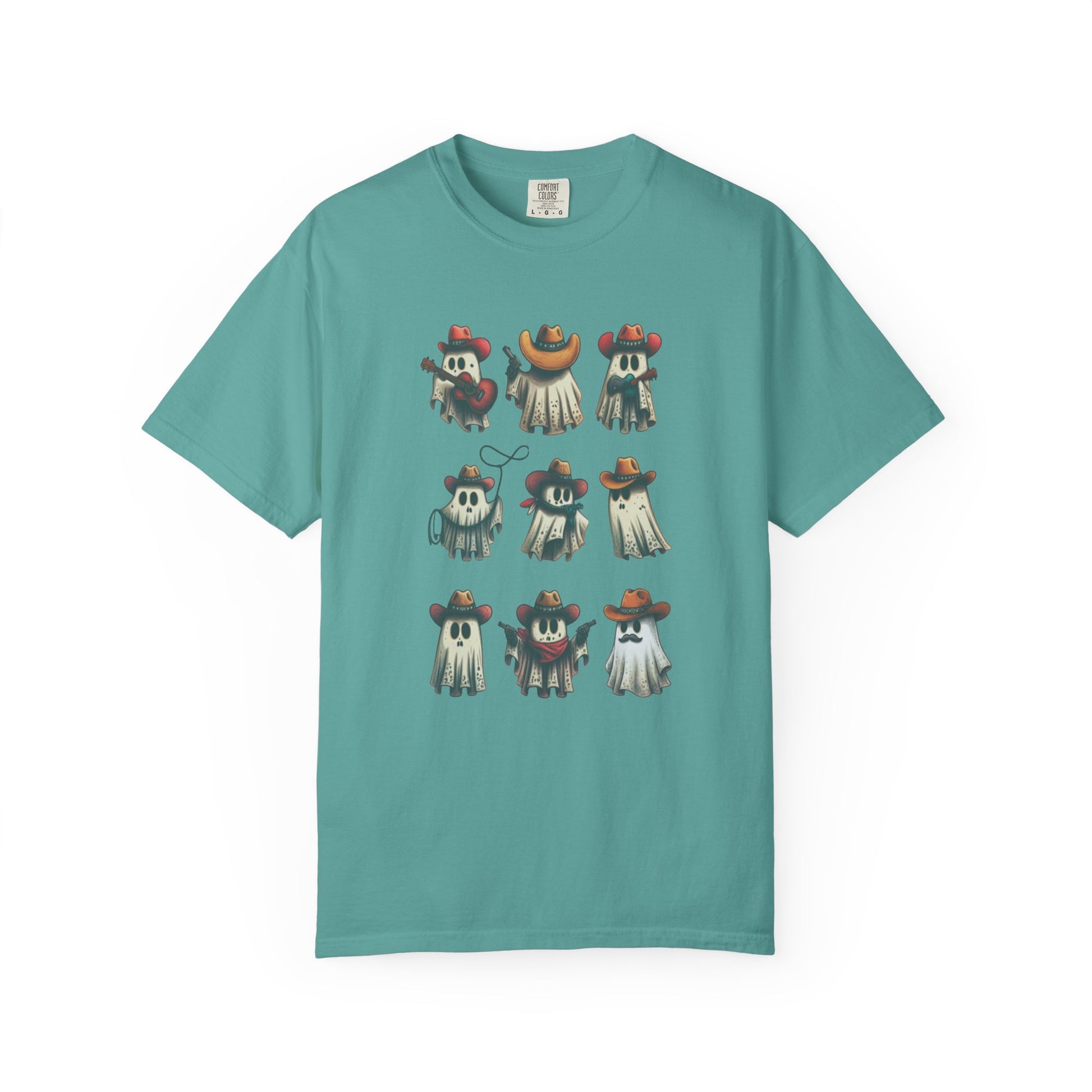 A teal short-sleeve crewneck t-shirt featuring a graphic print of nine cartoon ghosts wearing various colorful sombreros, displayed against a solid white background.