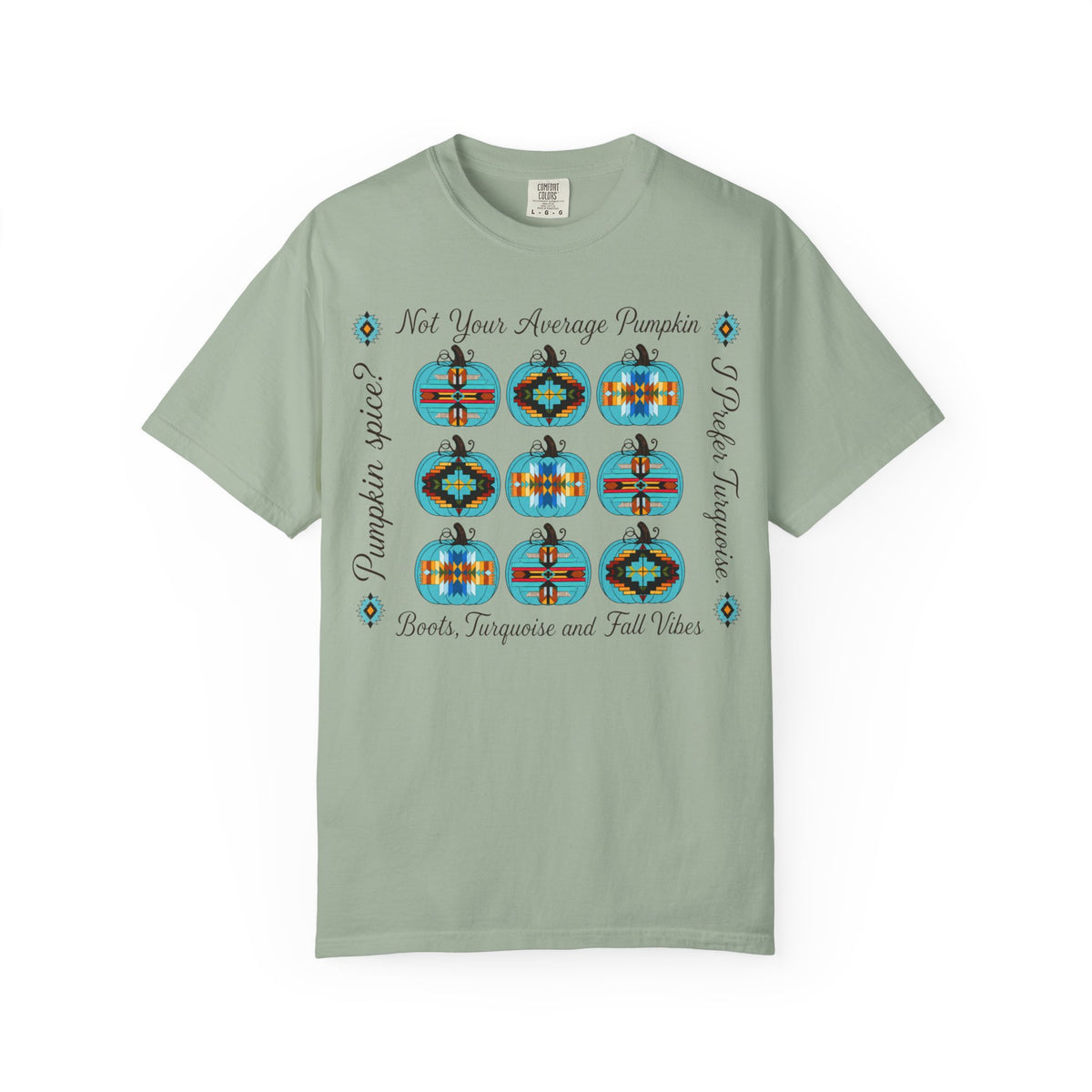 A sage green short-sleeve t-shirt with a graphic print of nine colorful patterned pumpkins and text reading 'Not Your Average Pumpkin' and 'Pumpkin Spice Boots, Taqueria and Fall Vibes' on a white background.