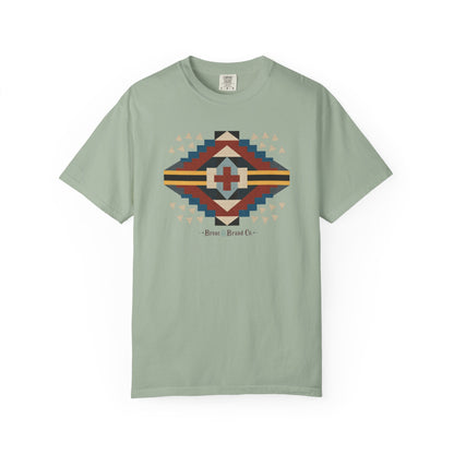 A sage green short-sleeve crewneck t-shirt featuring a circular graphic on the chest with text Bronc and Brand Co