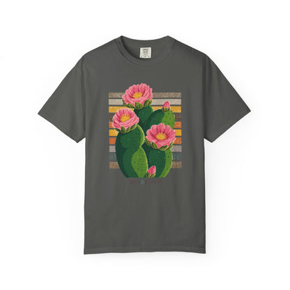 A dark gray short-sleeve t-shirt with a graphic print of a green prickly pear cactus with three pink flowers and a retro striped background, displayed flat against a white background.