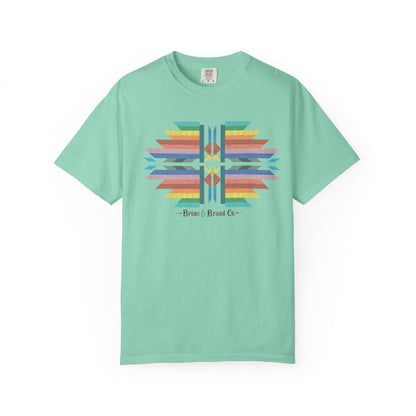 A mint green short-sleeve t-shirt with a colorful geometric graphic on the chest and the text 'Bronc & Brand Co.' printed below it, displayed against a plain white background.