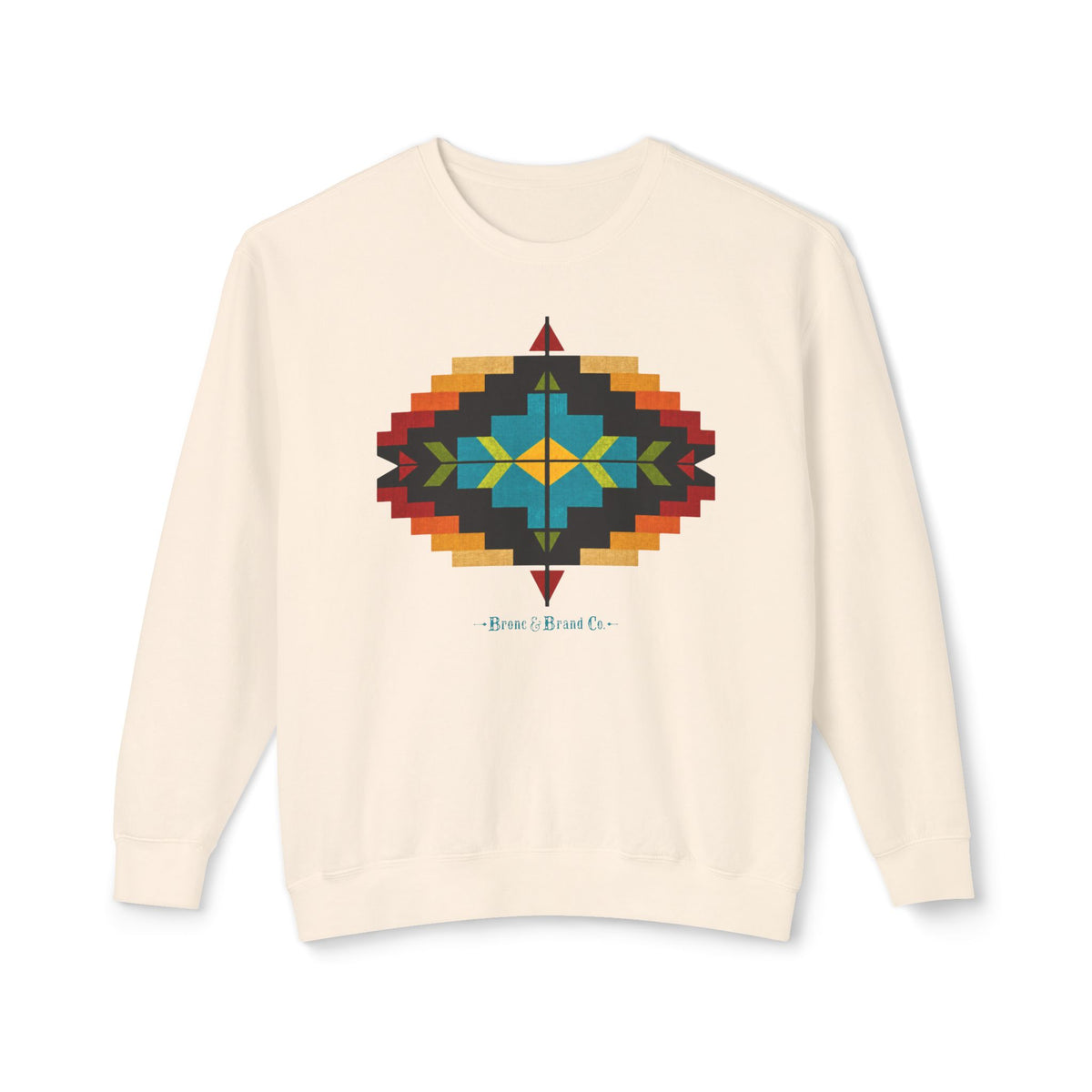 An off-white crewneck sweatshirt featuring a colorful geometric Southwestern-style diamond pattern on the chest, with the text 'Bronc & Brand Co.' printed below it.