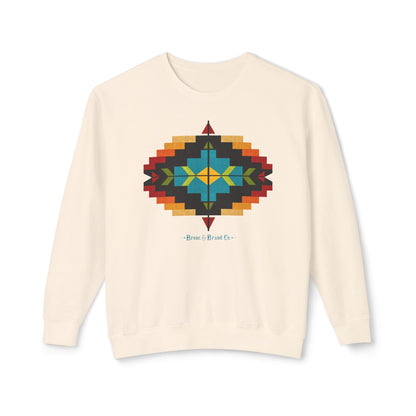 An off-white crewneck sweatshirt featuring a colorful geometric Southwestern-style diamond pattern on the chest, with the text 'Bronc & Brand Co.' printed below it.