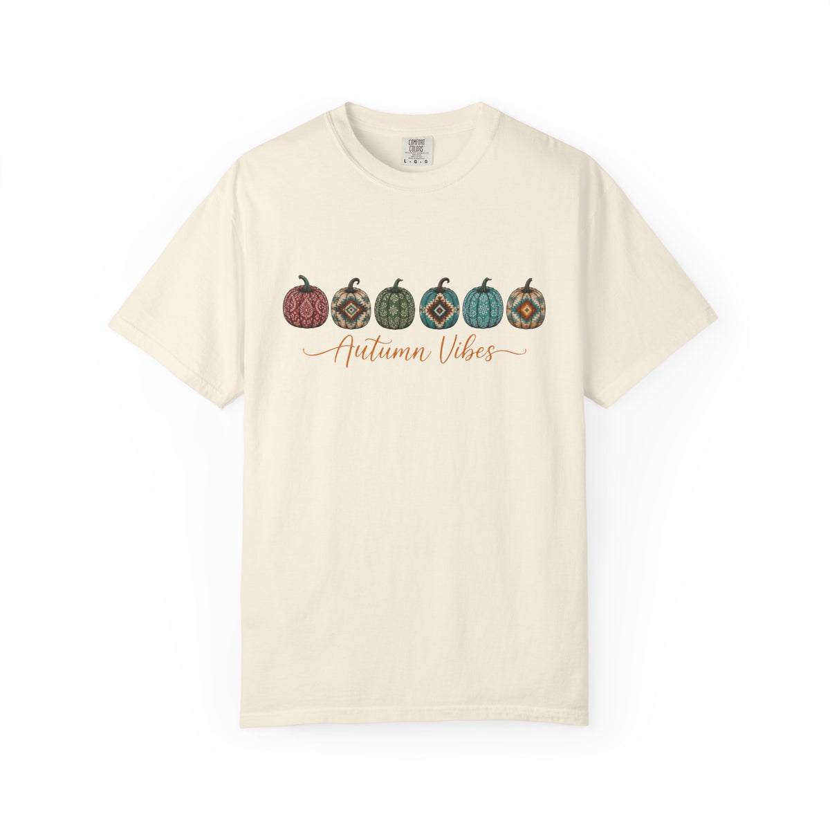An off-white short-sleeve crewneck t-shirt featuring a graphic of five patterned pumpkins in autumn colors and the text 'Autumn Vibes' in orange cursive across the chest, displayed on a clean white background.