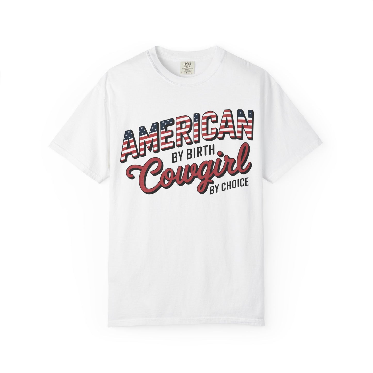 American by Birth Cowgirl by Choice tee with patriotic western lettering laid flat against white background