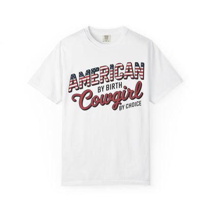 American by Birth Cowgirl by Choice tee with patriotic western lettering laid flat against white background
