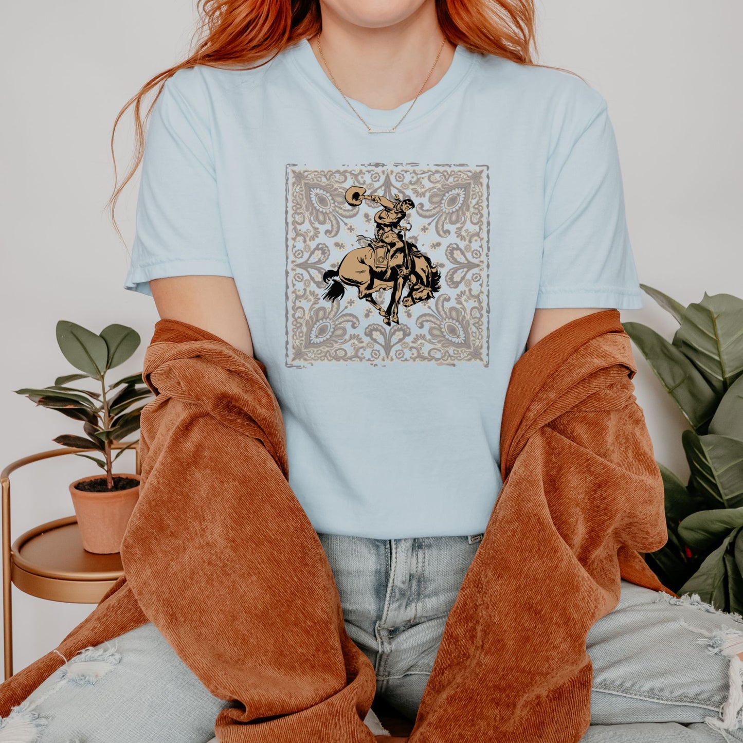 Bandana bronco cowgirl graphic tee on model in color chambray