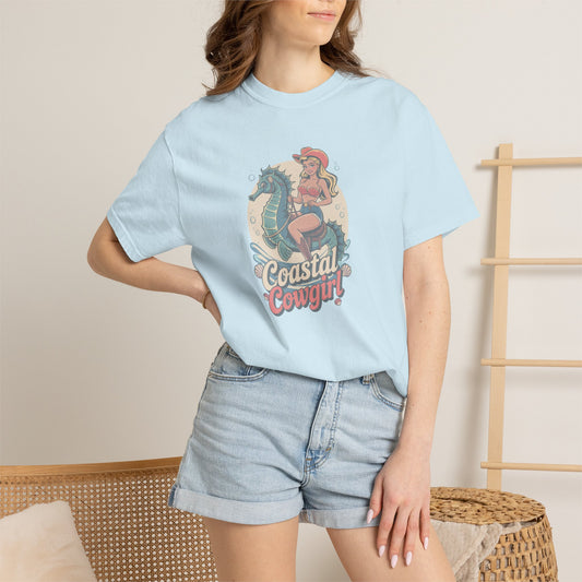 Beach seahorse cowgirl t-shirt with vintage horse and seahorse graphic and Coastal Cowgirl text on model in chambray