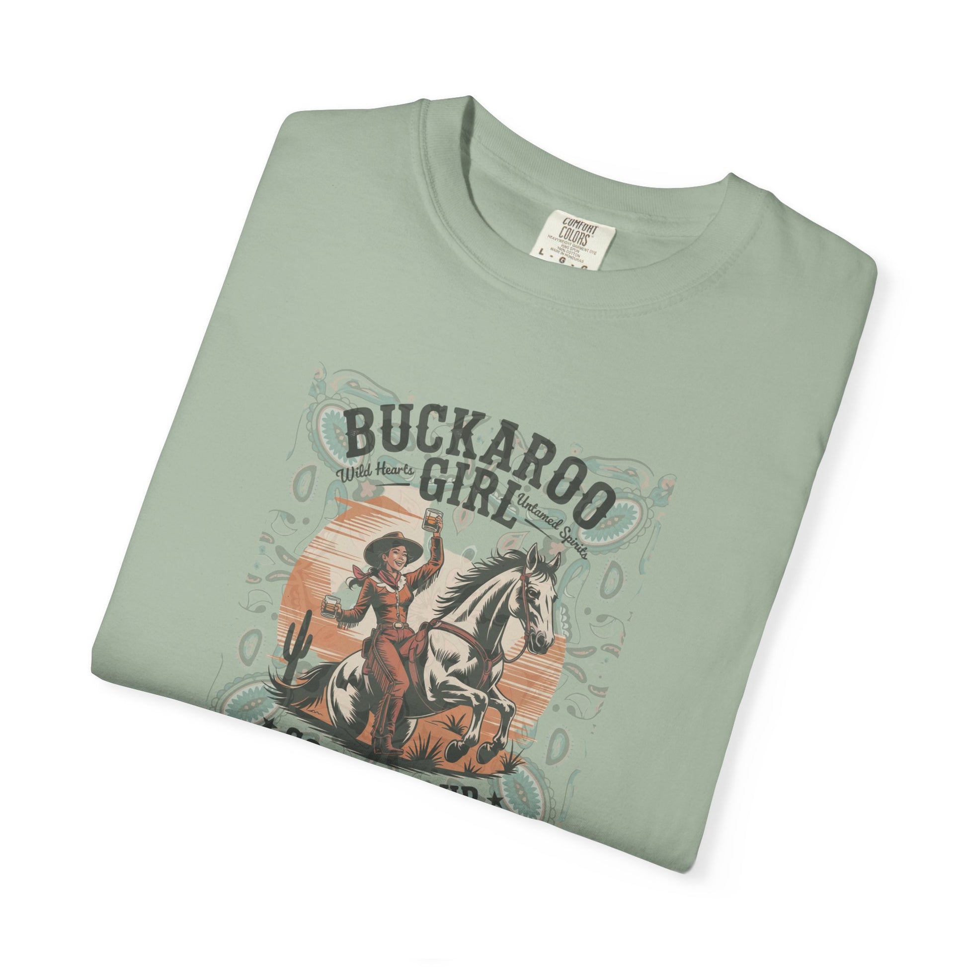 Buckaroo Spirits tee with vintage cowgirl riding horse graphic and western paisley border folded in color bay