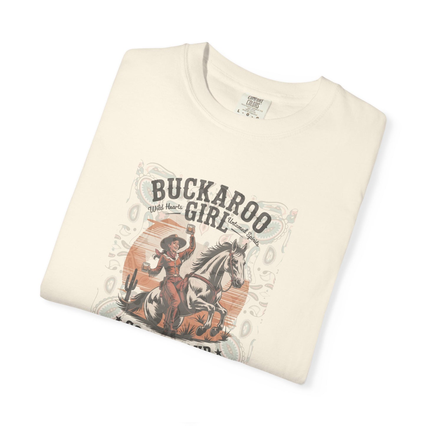 Buckaroo Spirits tee with vintage cowgirl riding horse graphic and western paisley border folded in color ivory