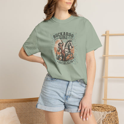 Buckaroo Spirits tee with vintage cowgirl riding horse graphic and western paisley border on model in color bay
