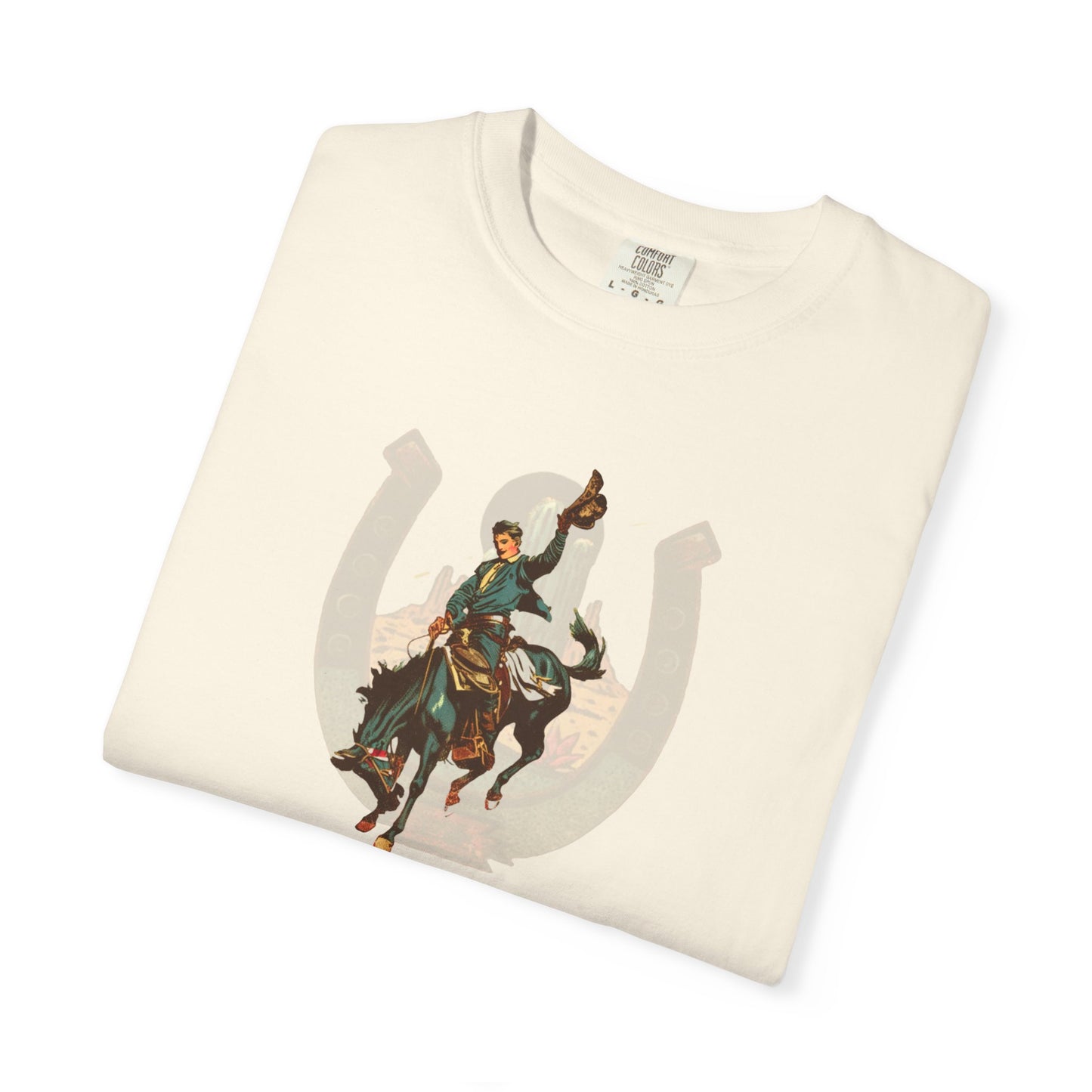 Buckaroo horseshoe tee with vintage bronc rider and desert cactus graphic folded on white background in ivory