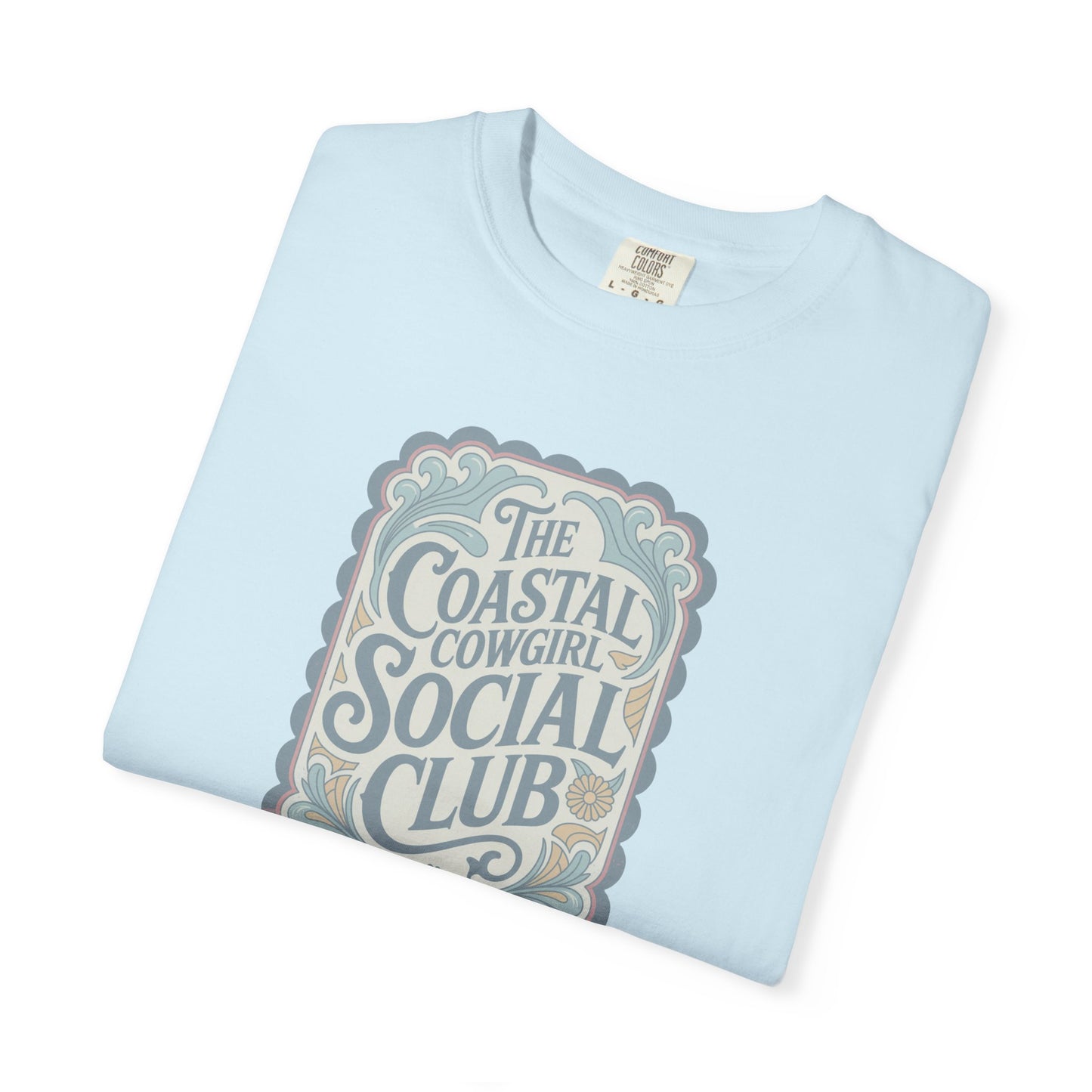 Coastal Cowgirl Clubhouse tee with vintage western sign print and retro coastal colours folded in color chambray