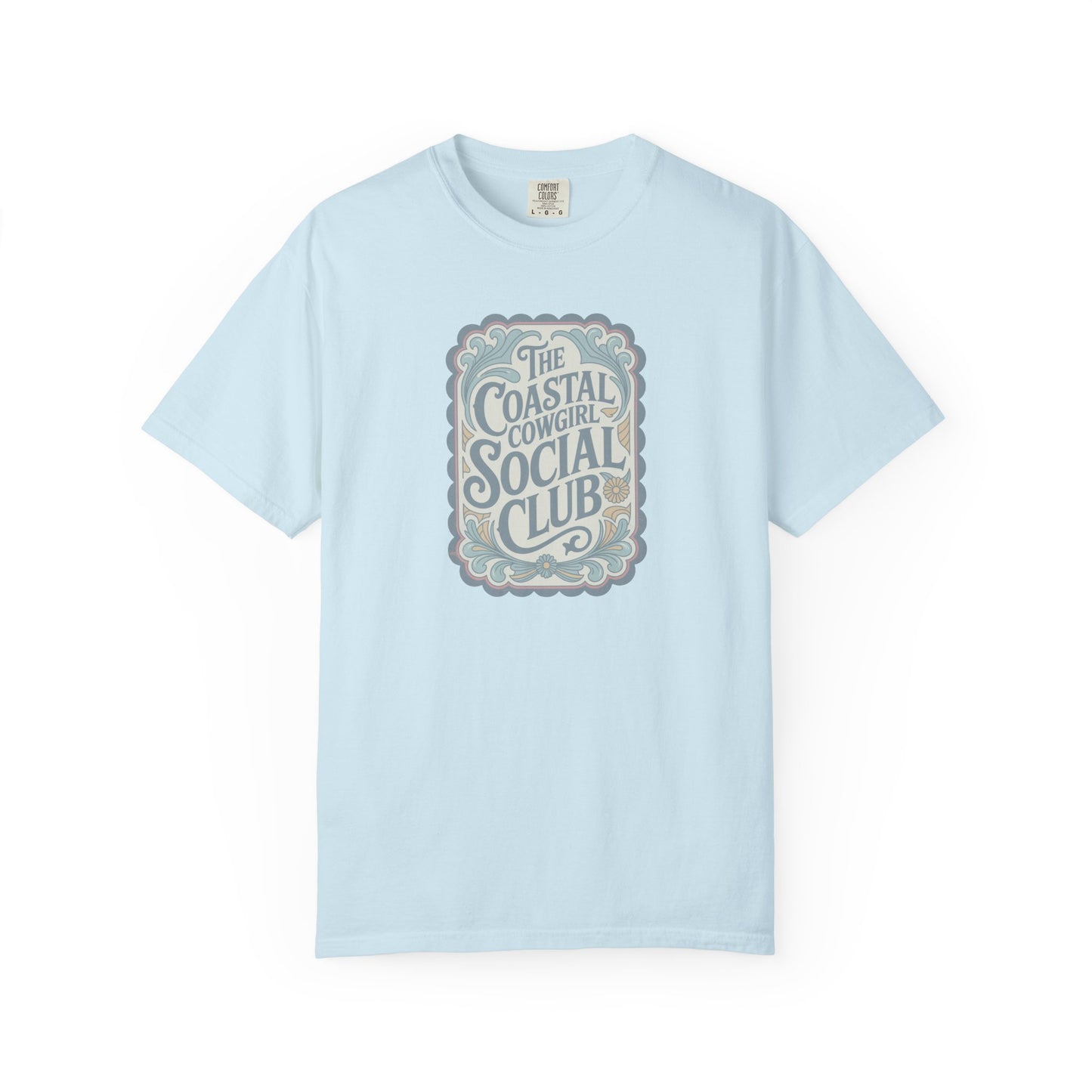 Coastal Cowgirl Clubhouse tee with vintage western sign print and retro coastal colours front view in color chambray