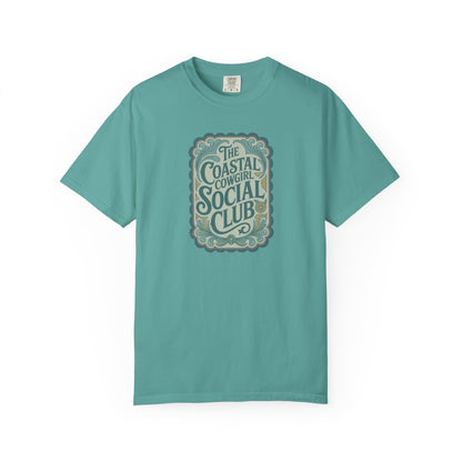 Coastal Cowgirl Clubhouse tee with vintage western sign print and retro coastal colours front view in color seafoam