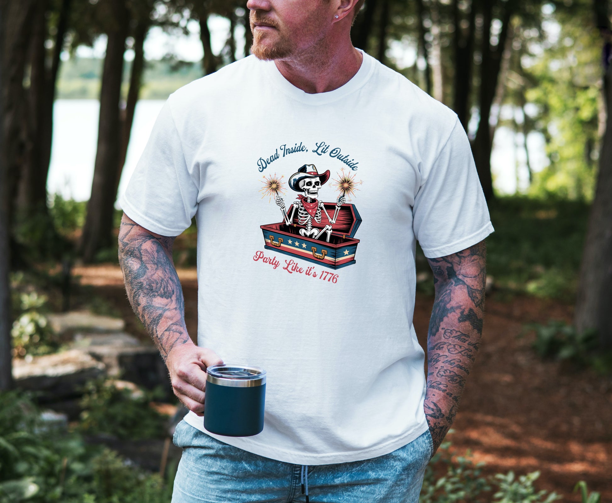 Dead Inside Lit Outside graphic tee with patriotic skeleton cowboy graphic on male model