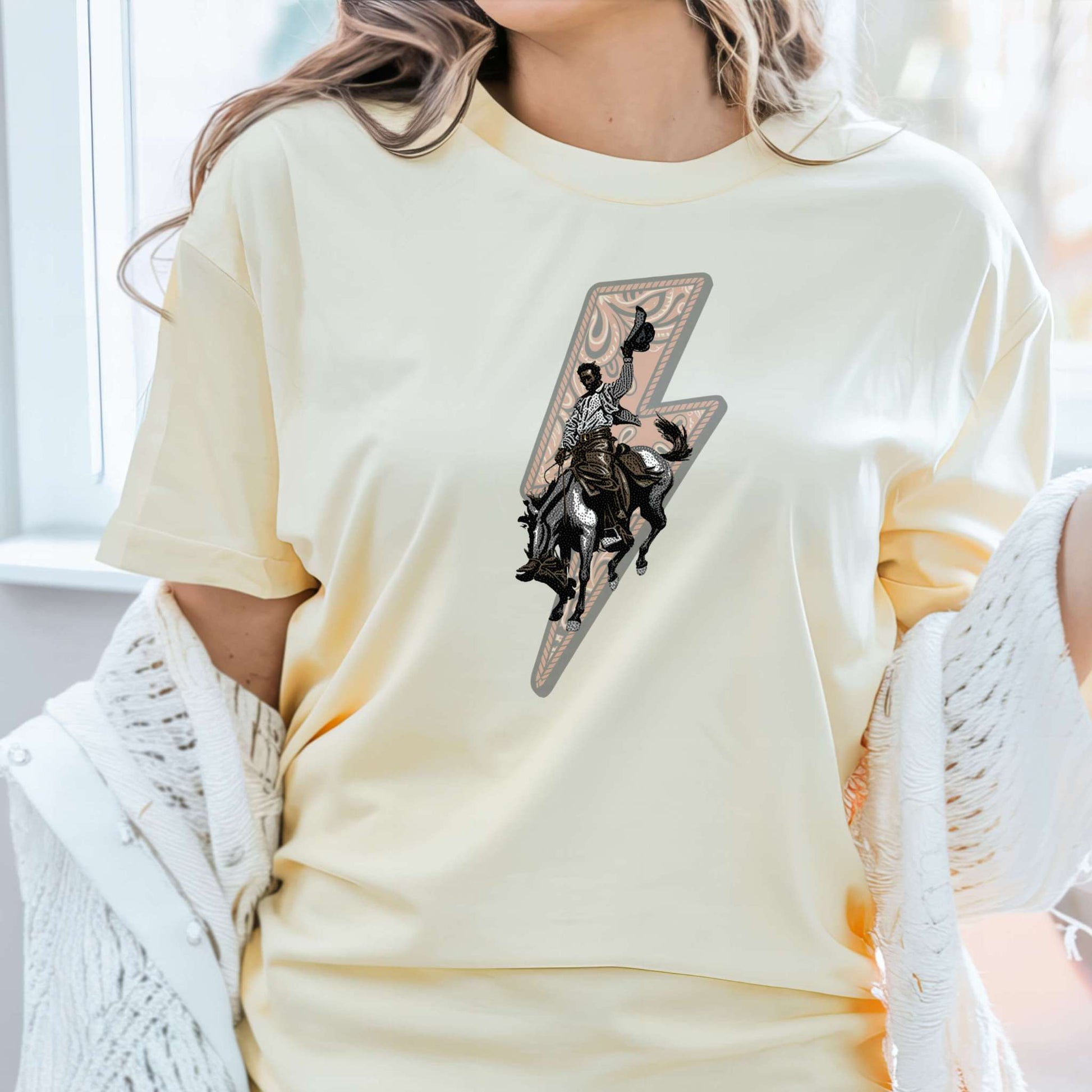 Lightning Rider Cowboy Tee on model in color butter