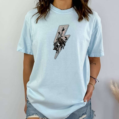 Lightning rider cowboy tee on model in color chambray