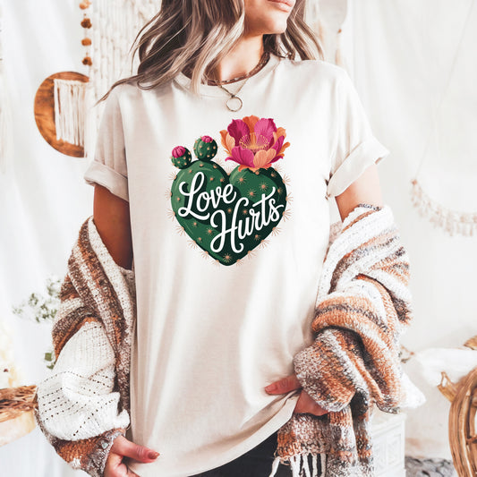 Love Hurts cactus heart Comfort Colors graphic t-shirt with pink bloom succulent design