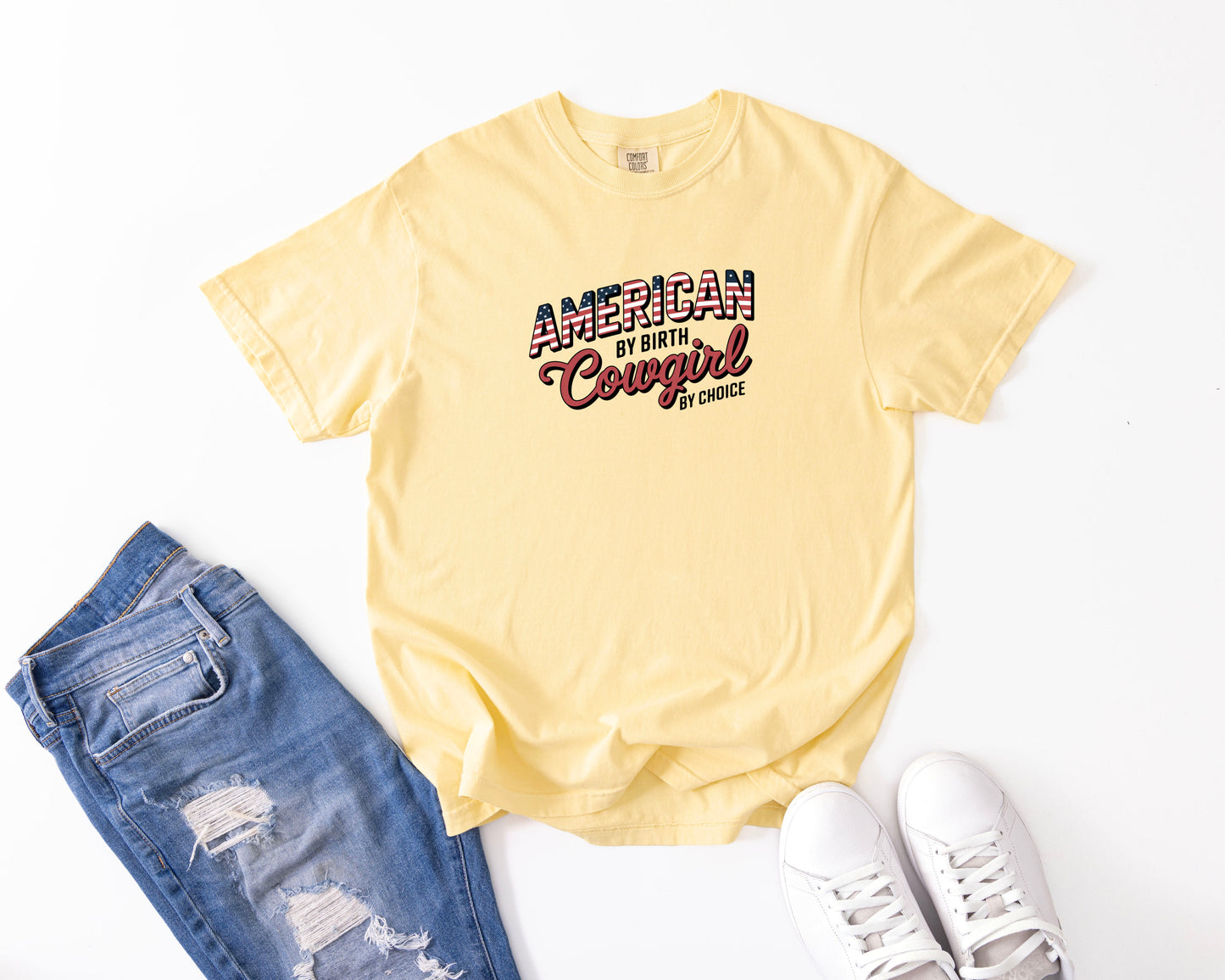 american by birth butter tee laying flat