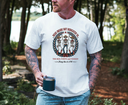 Red White and Yeehaw tee with funny 4th of July western graphic on model outdoors holding a coffee in color white