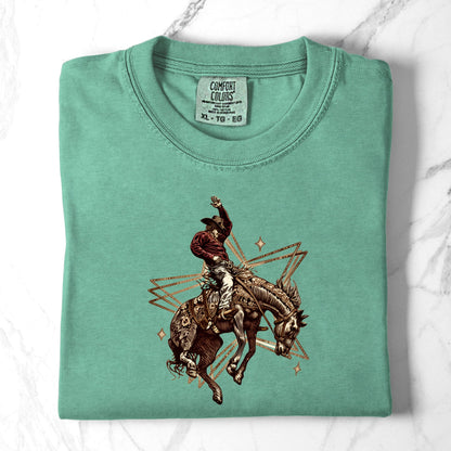 Rodeo Rebel Graphic Tee folded in color island reef