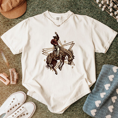 Rodeo Rebel Graphic Tee folded in color ivory