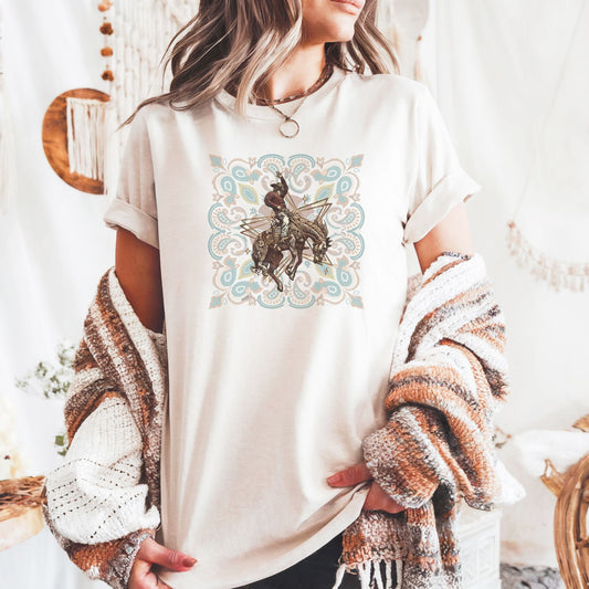 Rodeo spirit bronco tee on model in color ivory